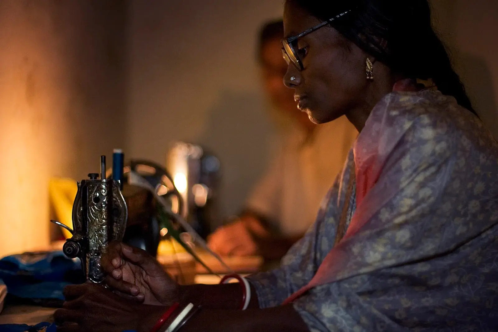 A woman working at a sewing machine